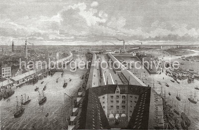 0136 Blick vom Kaiserspeicher auf den Grasbrookhafen und den Sandtorhafen; das Hafenbecken des Sandtorhafens wurde 1866 geschaffen. Hier wurden die Seeschiffe direkt am Kai abgefertigt und die Ladung nicht mehr ber Schuten und Lastkhne im Elbstrom gelscht. Hinter den Hafenschuppen rechts die Wohnbebauung auf dem Brook und die Kirchtrme der St. Katharinenkirche und Nikolaikirche. Im Hintergrund der qualmende Schlot der Gasanstalt auf dem Grasbrook rechts die Eisenbahnbrcke ber die Elbe, die 1872 errichtet wurde. Ab 1883 wurden die Wohnviertel auf den Elbinseln Kehrwieder und Wandrahm abgerissen, um die Speicherstadt zu errichten. Etwa 20 000 Menschen wurden zwangsumgesiedelt und ca. 1100 Huser zerstrt.